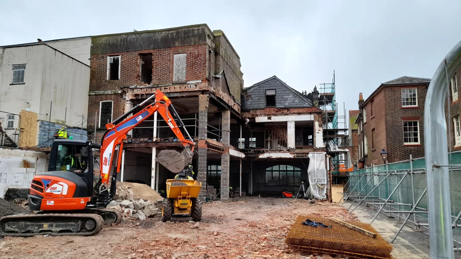 Excavator and dumper working on a demolition and renovation site