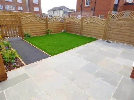 Finished garden patio with lawn, paving, fencing and planting