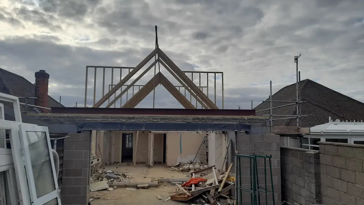 Roof extension in progress with steel beam, timber framing and blockwork