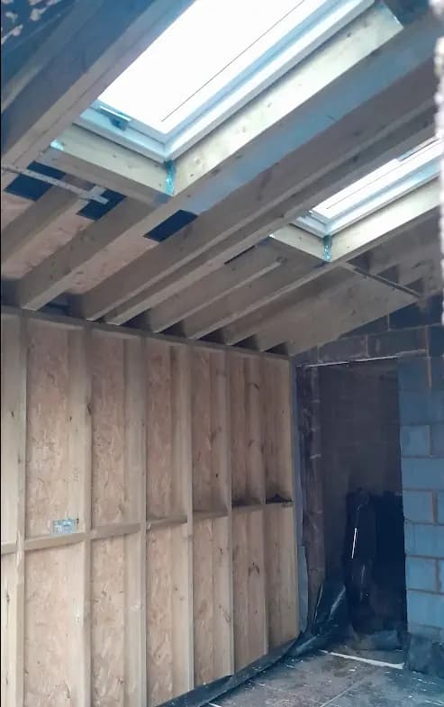 Unfinished roof framing with skylights, OSB and blockwork