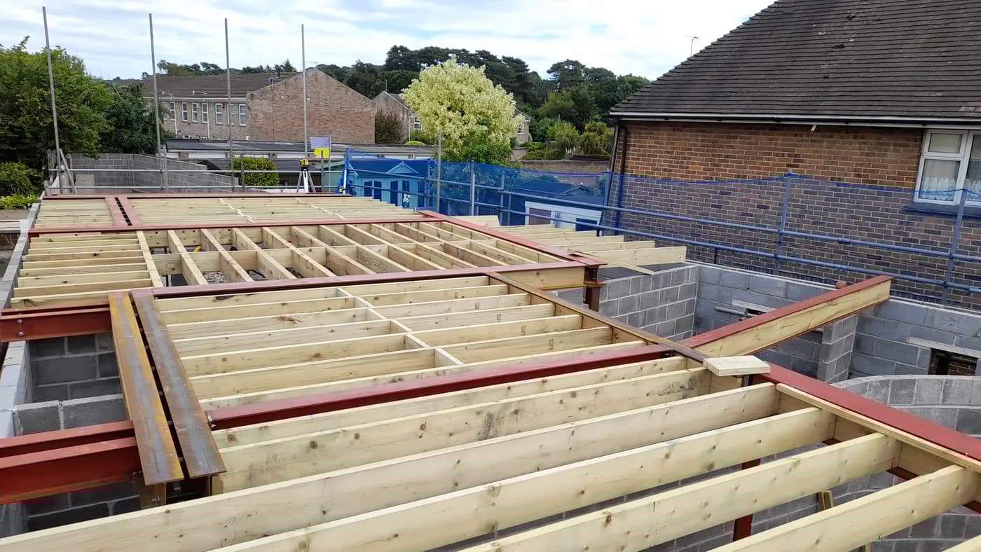 Residential timber and steel frame surrounded by scaffold