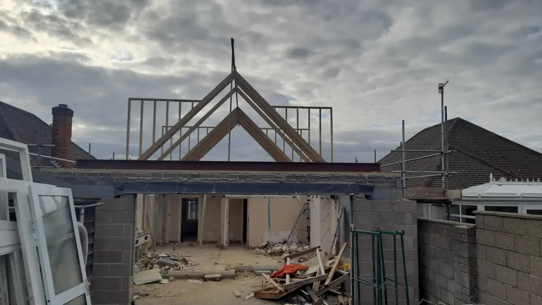 Steel beam supporting roof extension work