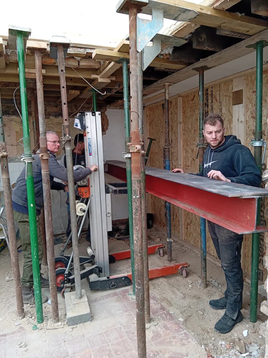 Temporary supports and steel installation during a structural opening